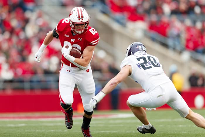 Wisconsin tight end Jack Eschenbach breaks a tackle against Northwestern.